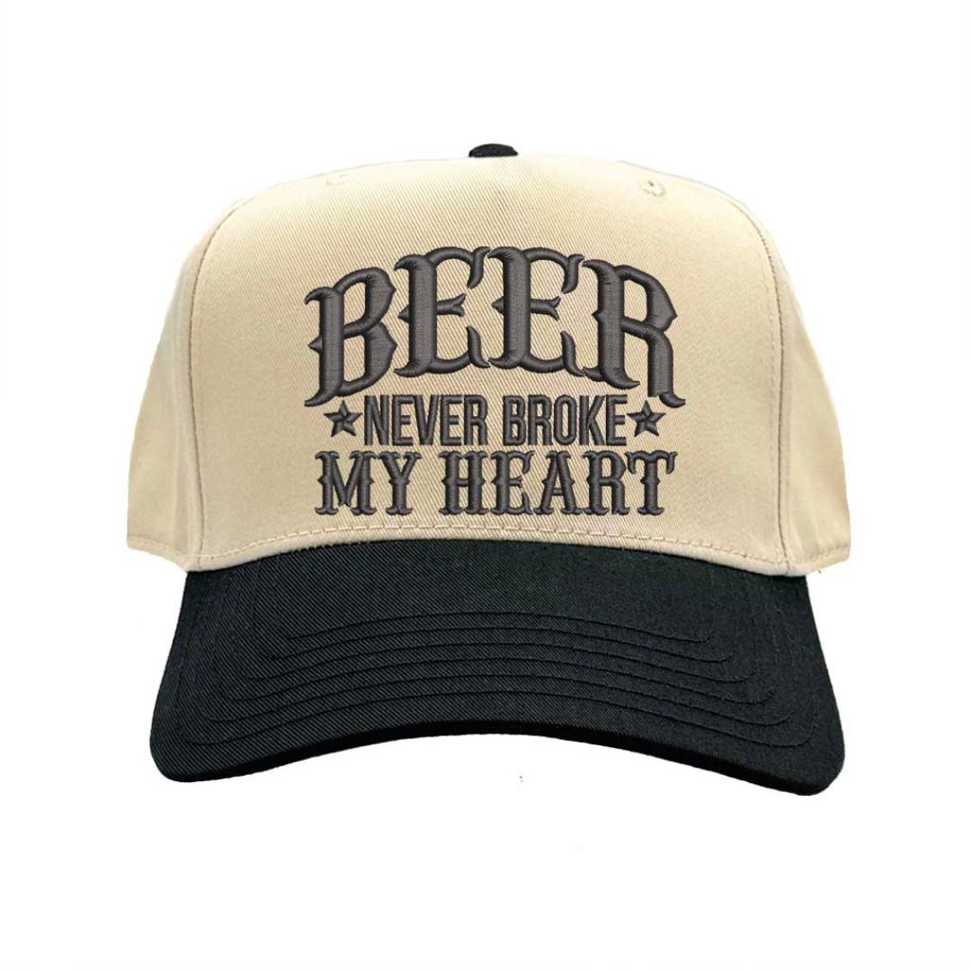 Close-up of Natural Black “Beer Never Broke My Heart” embroidery on two-tone baseball cap – DSY Lifestyle