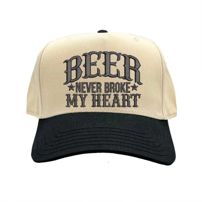 Close-up of Natural Black “Beer Never Broke My Heart” embroidery on two-tone baseball cap – DSY Lifestyle