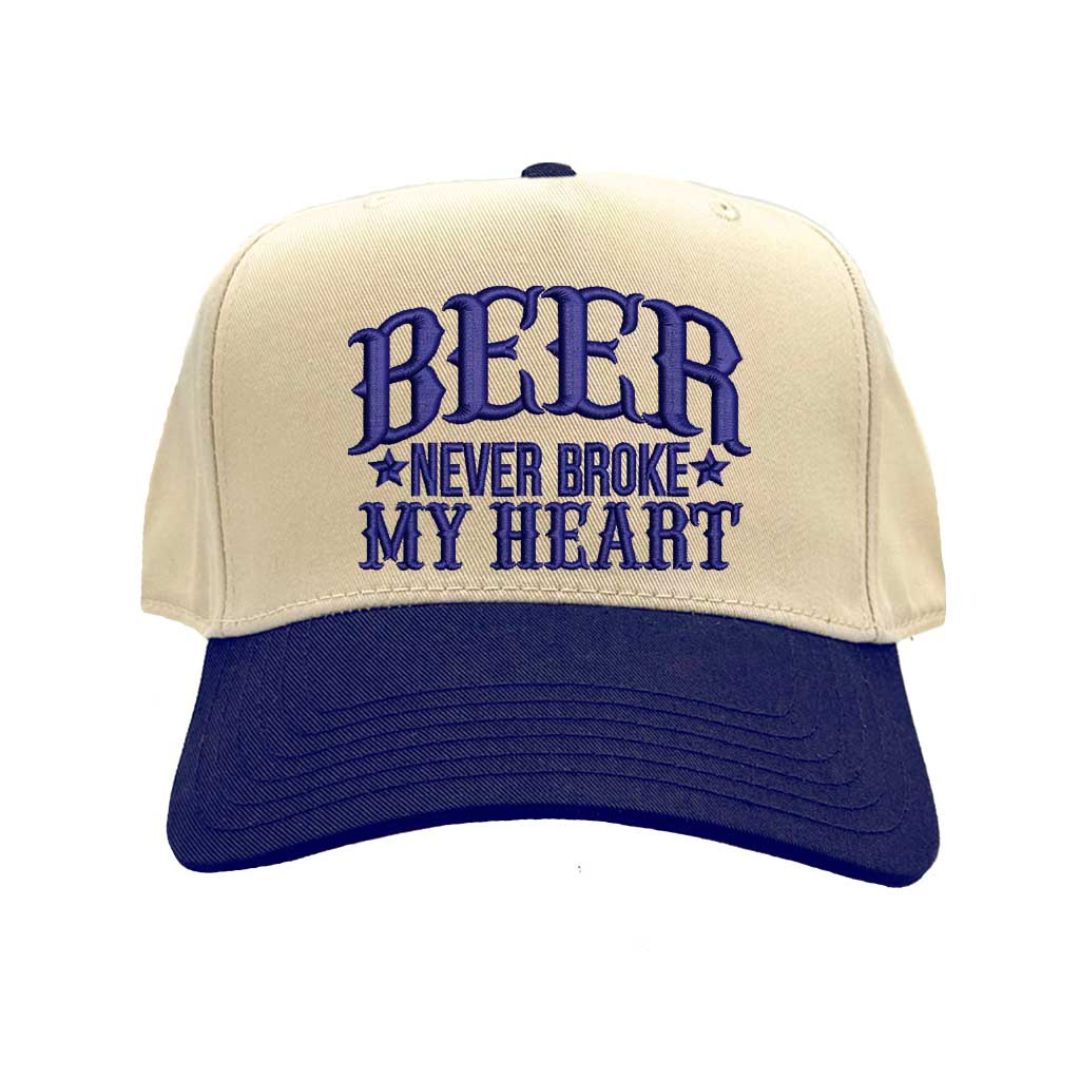Close-up of Natural Navy Blue “Beer Never Broke My Heart” embroidery on two-tone baseball cap – DSY Lifestyle