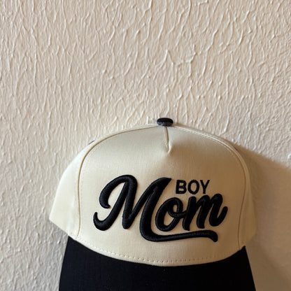 Close-up of Boy Mom machine embroidery on a two-tone trucker hat