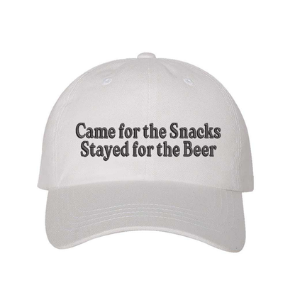 White Came for the Snacks Stayed for the Beer Embroidered Baseball Hat featuring premium embroidery, breathable cotton, and an adjustable strapback design. – DSY Lifestyle
