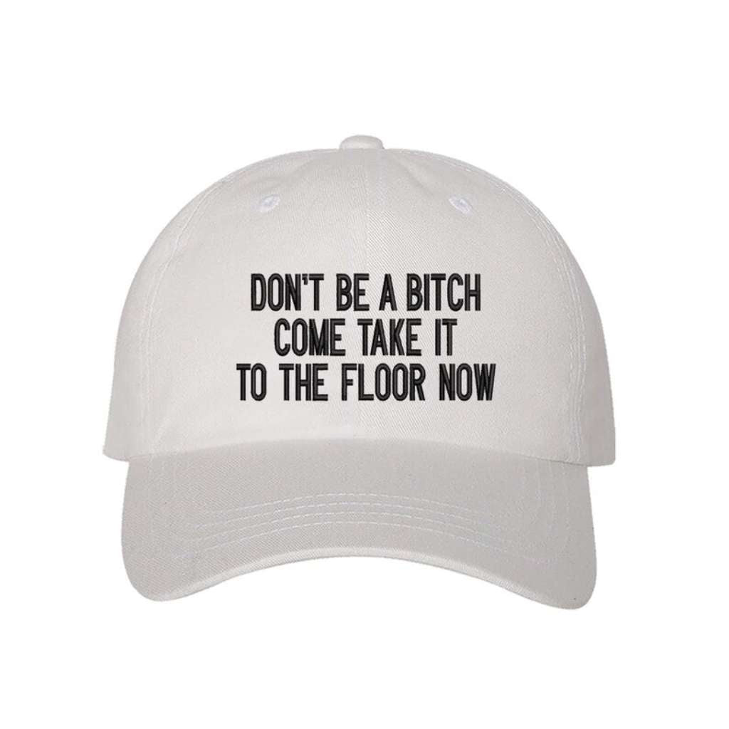 White baseball hat embroidered with the phrase Don&