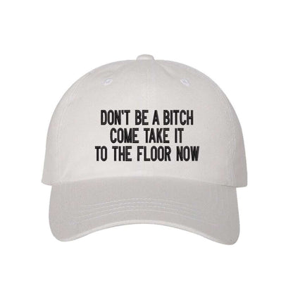 White baseball hat embroidered with the phrase Don&