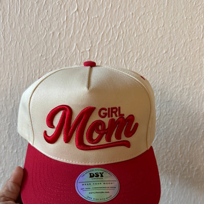 Close-up of Girl Mom machine embroidery on a two-tone trucker hat