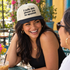 Model wearing the I Talk Shit About You in Spanish embroidered two-tone trucker hat