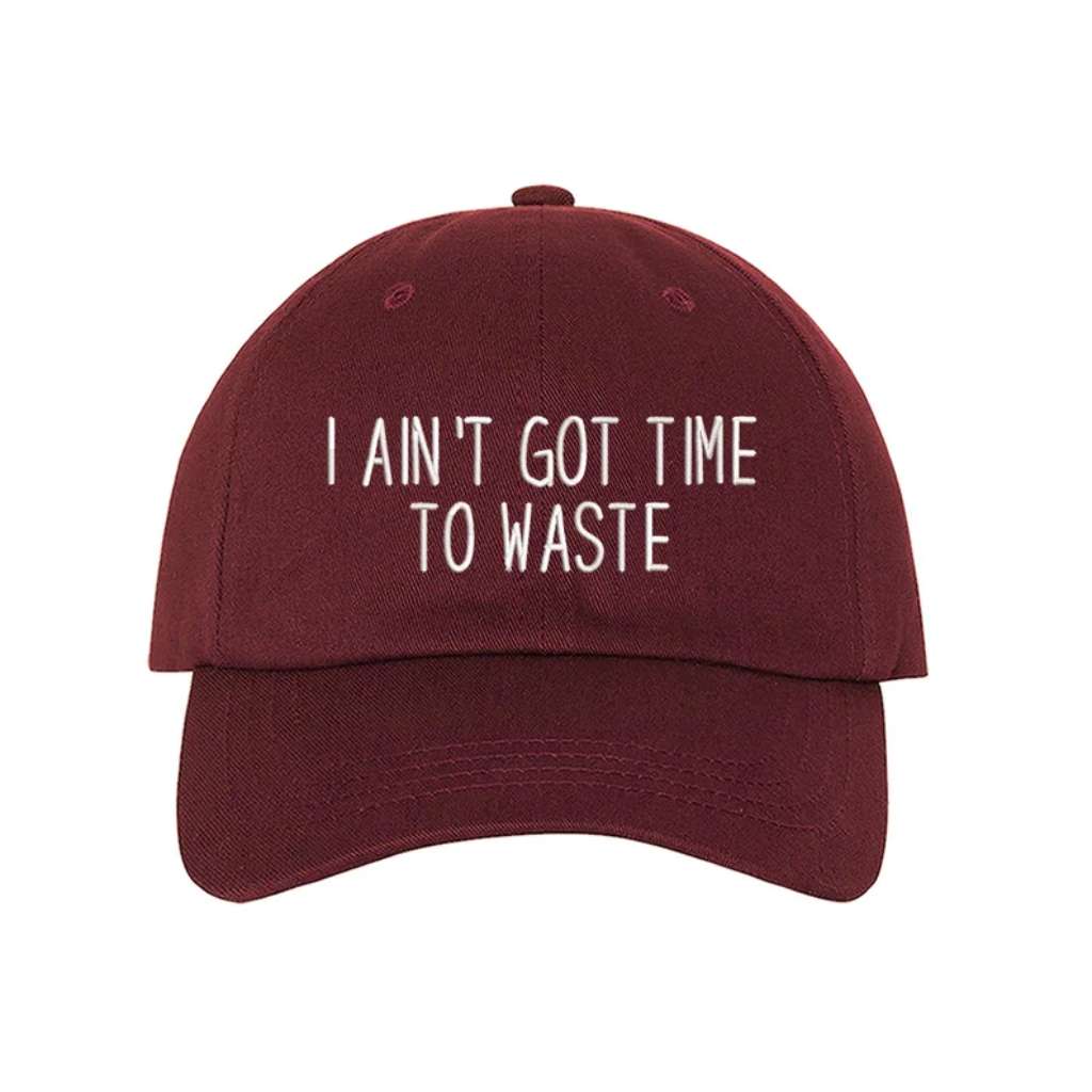 Burgundy baseball hat embroidered with the phrase I Ain&