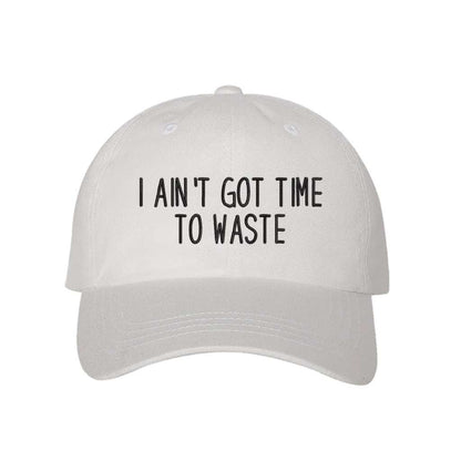 White baseball hat embroidered with the phrase I Ain&