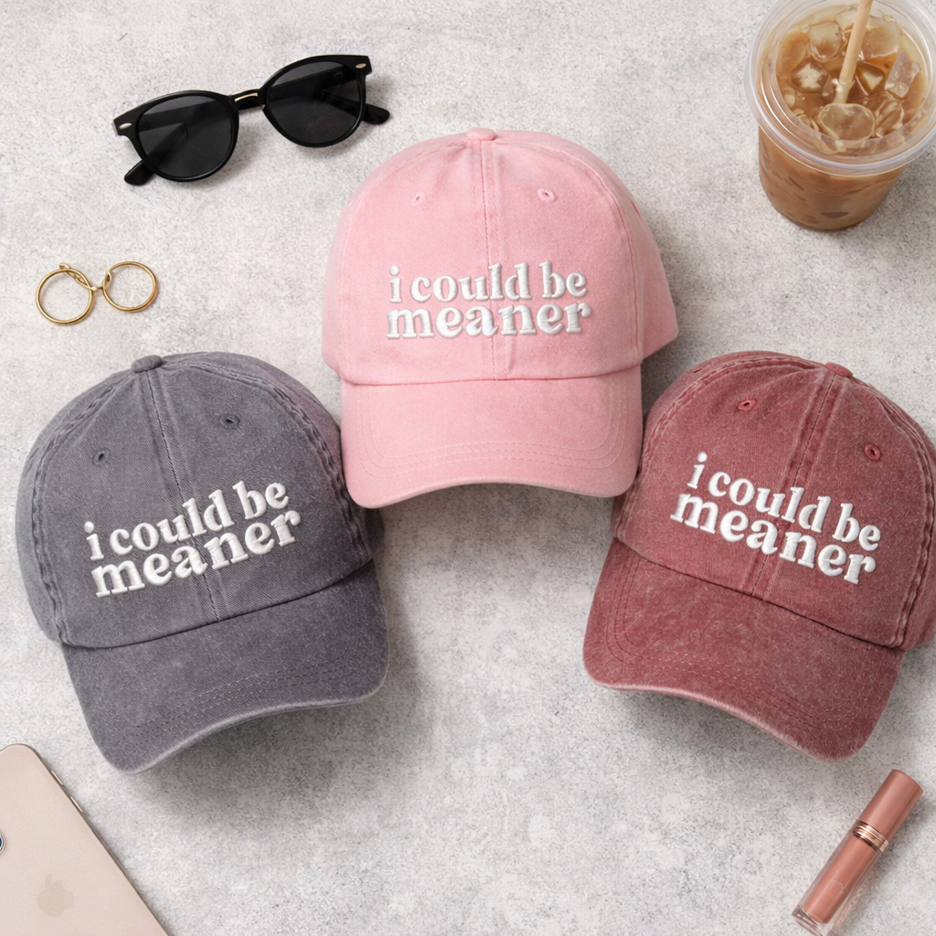 Flat lay of a Black, Pink, and Wine colored DSY Lifestyle washed cotton baseball hats featuring the phrase I Could Be Meaner in bold, professional embroidery. - DSY Lifestyle