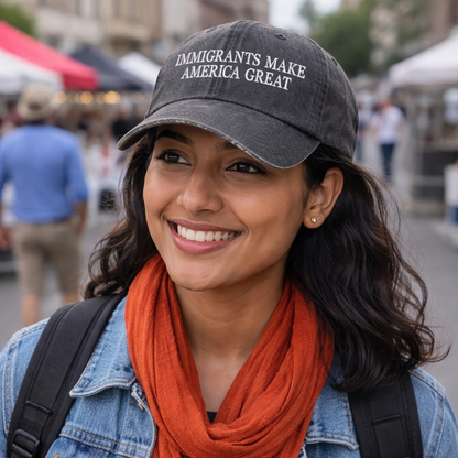 Female wearing a Gray DSY Lifestyle washed cotton baseball hat featuring the phrase Immigrants Make America Again in bold, professional embroidery. - DSY Lifestyle