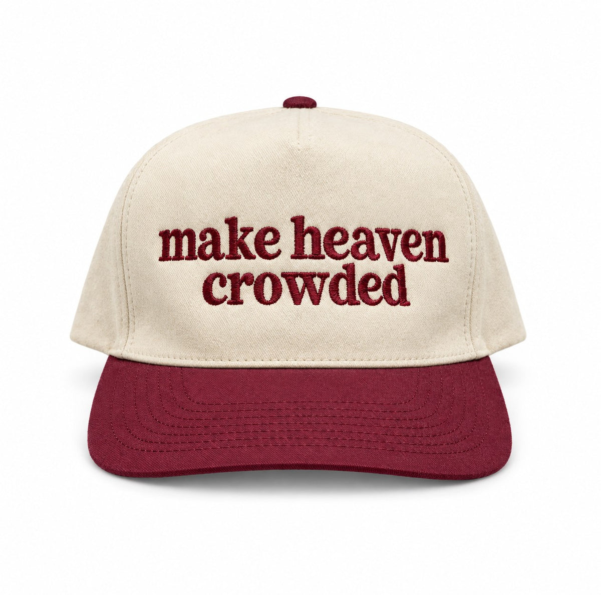 Make heaven crowded embroidered trucker hat with natural crown and maroon bill on a white background