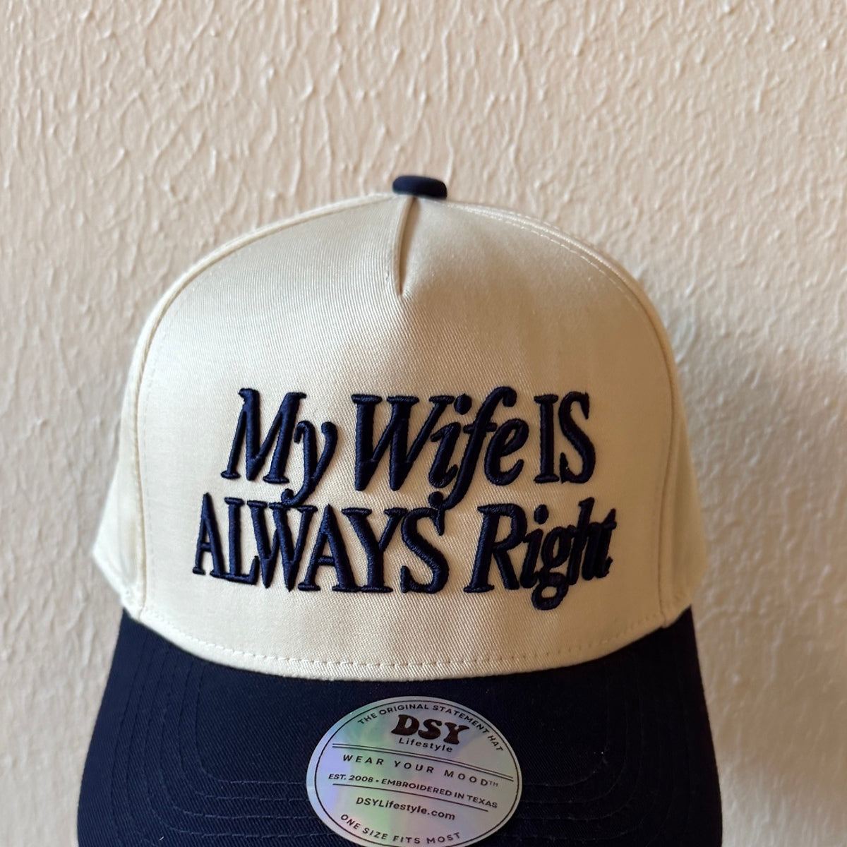 Close-up of My Wife Is Always Right machine embroidery on a two-tone trucker hat
