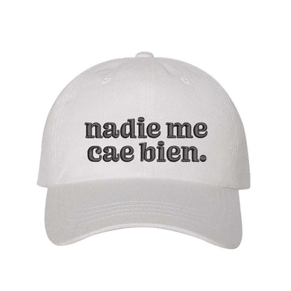 White Nadie Me Cae Bien embroidered baseball hat with adjustable hook &amp; loop closure, funny Spanish phrase cap for casual style and humor – DSY Lifestyle.