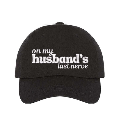 Black On My Husband’s Last Nerve Embroidered Baseball Hat in cotton with curved brim and adjustable strap closure. DSY Lifestyle.