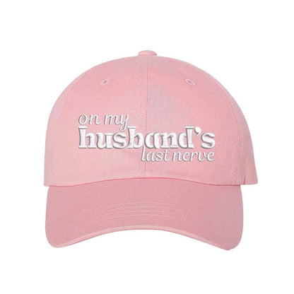 Light Pink On My Husband’s Last Nerve Embroidered Baseball Hat in cotton with curved brim and adjustable strap closure. DSY Lifestyle.