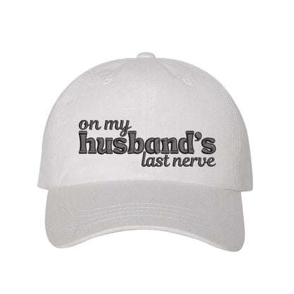 White On My Husband’s Last Nerve Embroidered Baseball Hat in cotton with curved brim and adjustable strap closure. DSY Lifestyle.