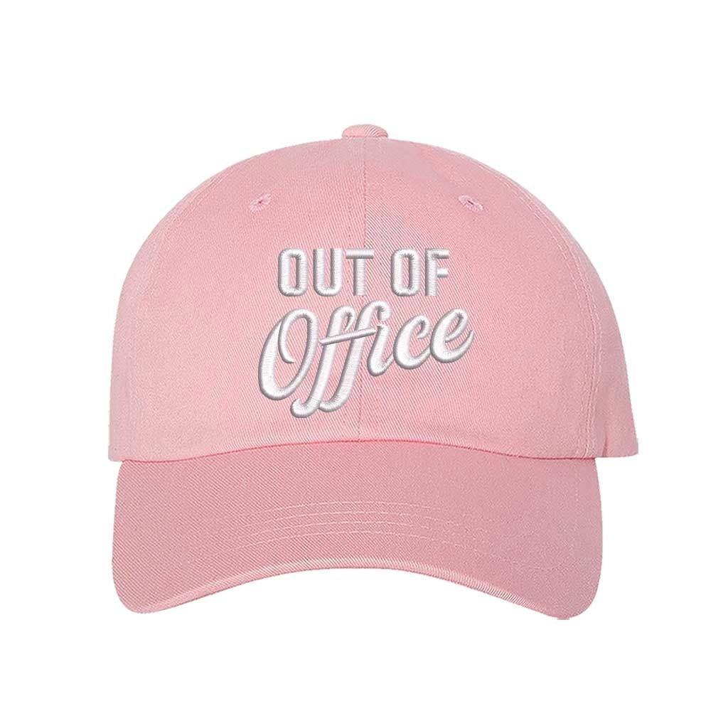 Light Pink Out of Office Embroidered Baseball Hat in breathable cotton with pre-curved brim and adjustable hook and loop closure, styled for vacation or casual wear. DSY Lifestyle.