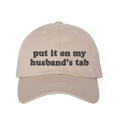 Stone Put It on My Husband’s Tab Embroidered Baseball Hat in soft cotton with curved brim and adjustable back strap, perfect for vacations and girls’ nights. DSY Lifestyle.
