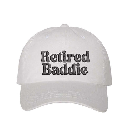 White Retired Baddie Embroidered Baseball Hat with curved brim and adjustable strap, styled for casual everyday wear. – DSY Lifestyle.