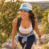 Woman hiking in Texas Hill Country wearing the She&