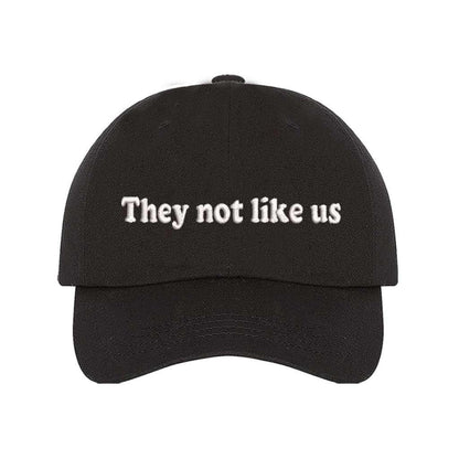 Black baseball hat embroidered with the phrase They Not Like Us -DSY Lifestyle