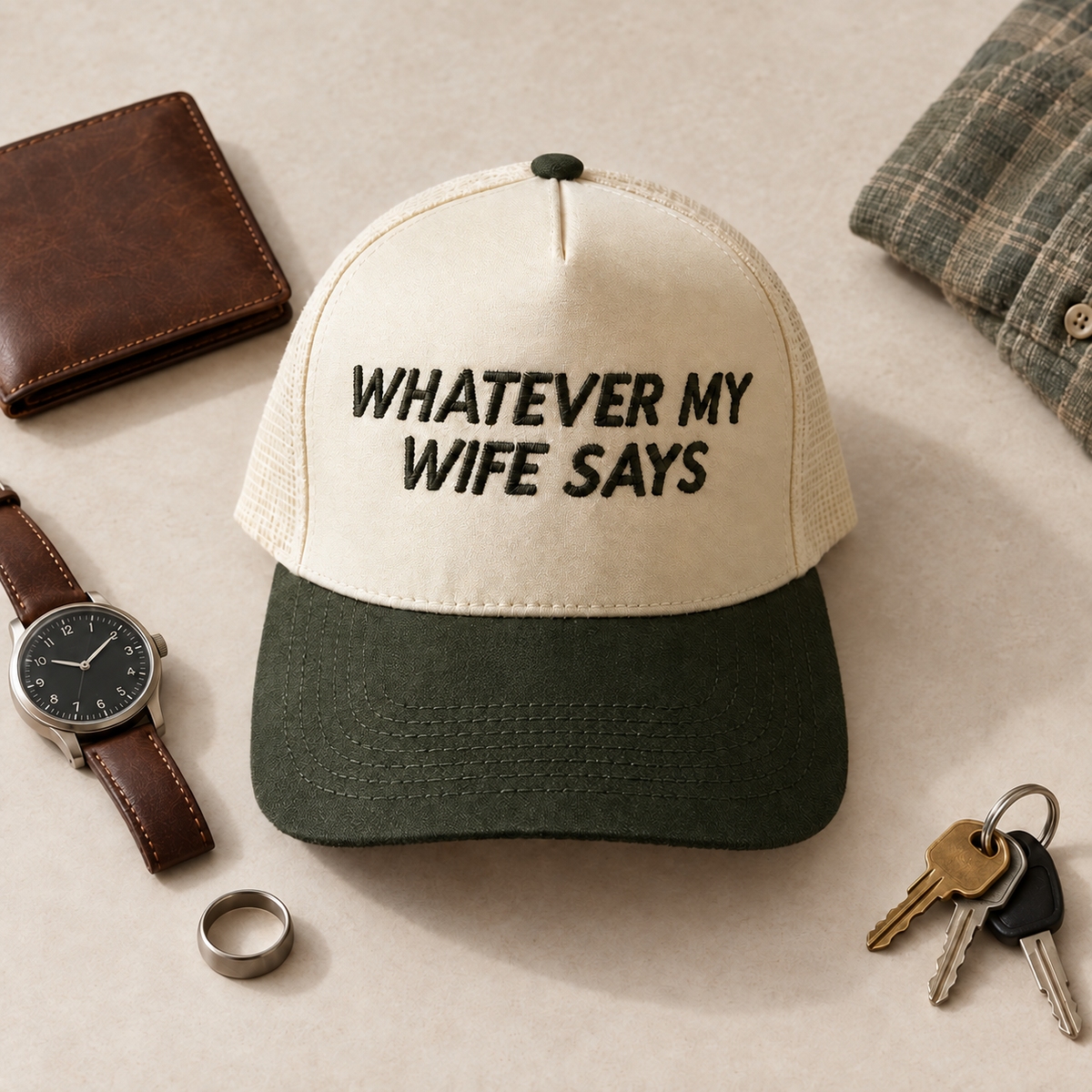 Whatever My Wife Says two-tone embroidered trucker hat styled flat lay