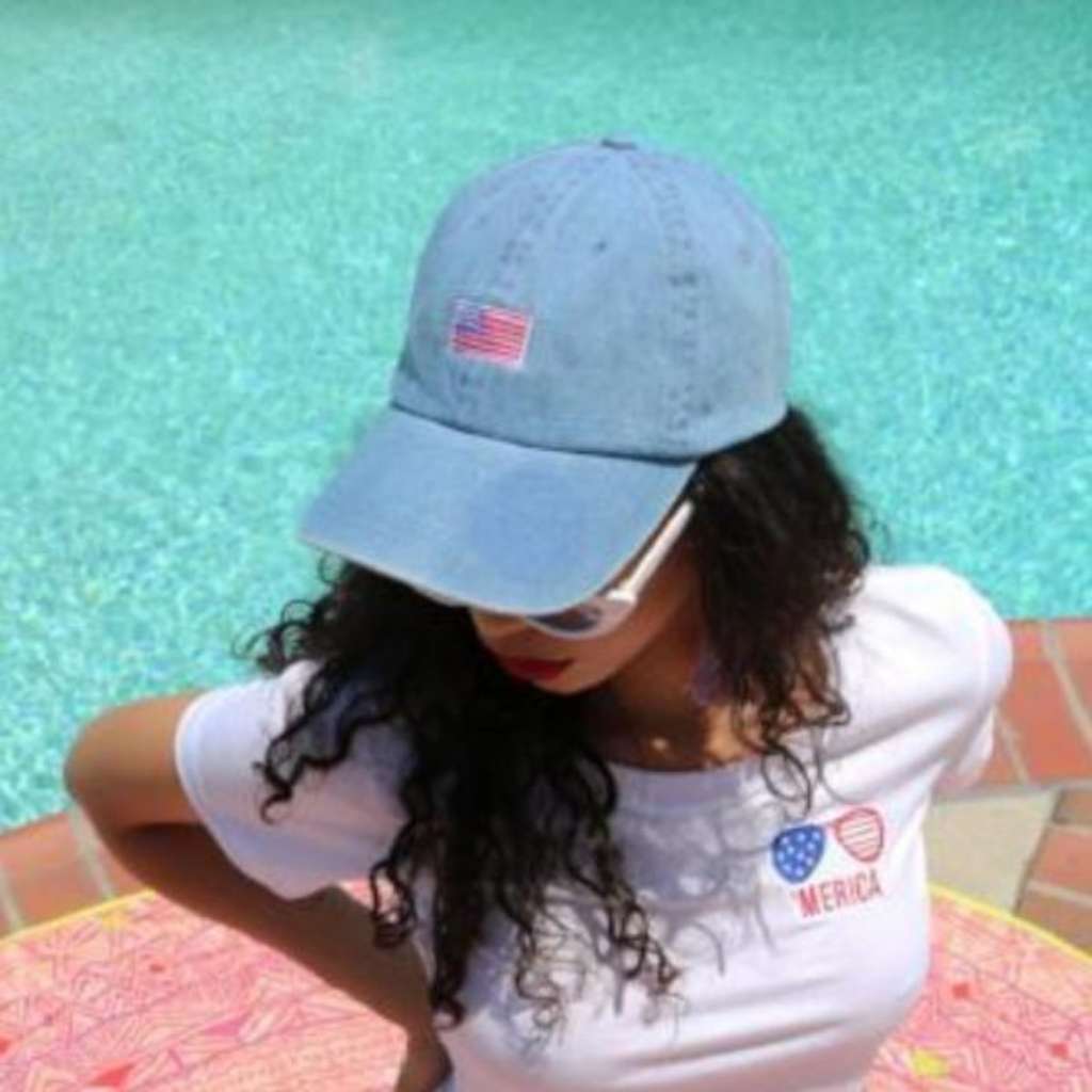 Model wearing light denim baseball hat with USA Flag embroidered on the front - DSY Lifestyle