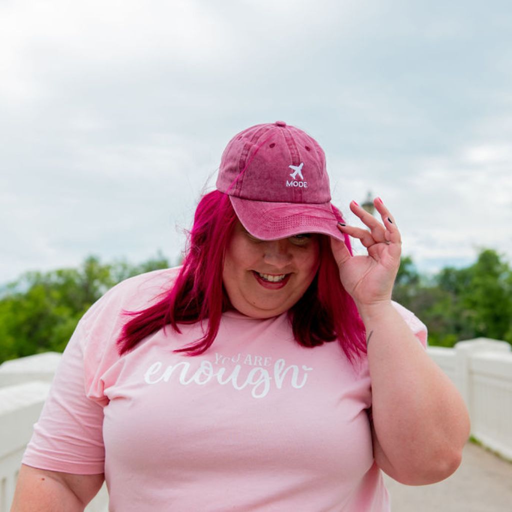 Female wearing a washed wine baseball cap embroidered with Airplane Mode - DSY Lifestyle