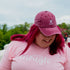 Female wearing a washed wine baseball cap embroidered with Airplane Mode - DSY Lifestyle