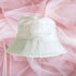 Flat lay of white bucket hat embroidered with Bride in white thread- DSY Lifestyle