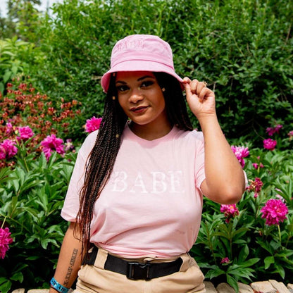 Female wearing a pink bucket hat embroidered with Babe with Pink  thread- DSY Lifestyle