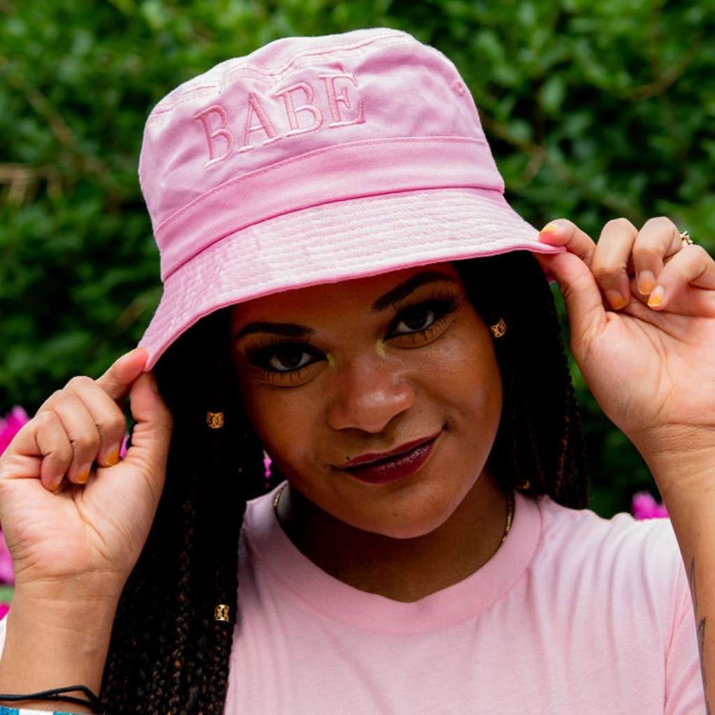 Female wearing a pink bucket hat embroidered with Babe with Pink  thread- DSY Lifestyle