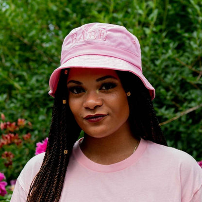 Female wearing a pink bucket hat embroidered with Babe with Pink  thread- DSY Lifestyle