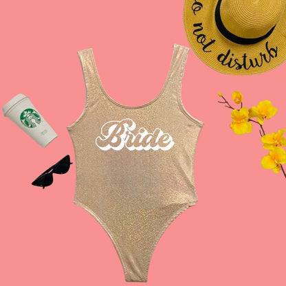 Flat lay of Bride Light Gold Glitter One Piece Swimsuit - DSY Lifestyle