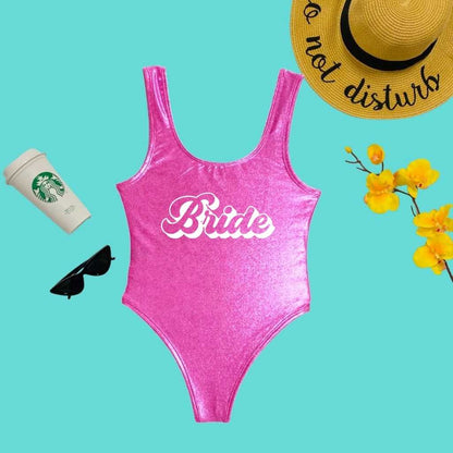 Flat lay of Bride Metallic Pink One Piece Swimsuit - DSY Lifestyle