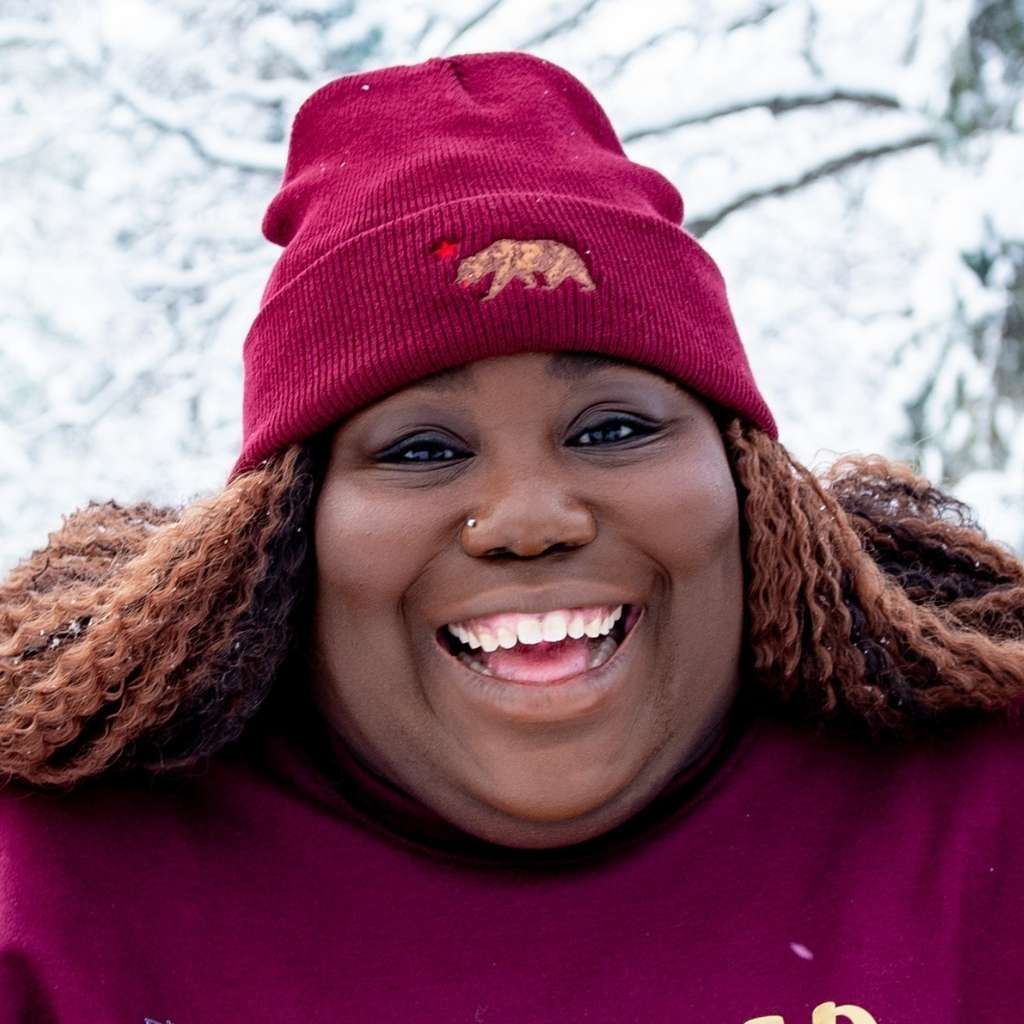 Model wearing burgundy cuffed beanie with California bear embroidered in front - DSY Lifestyle