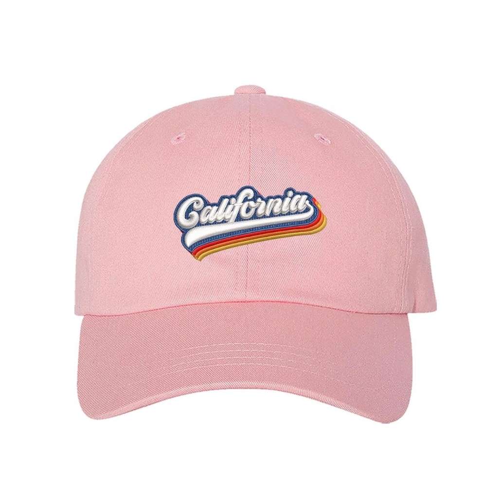 Light pink baseball hat with California embroidered in white with a rainbow underline - DSY Lifestyle