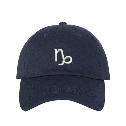 Navy blue baseball hat with Capricorn zodiac symbol embroidered in white - DSY Lifestyle 