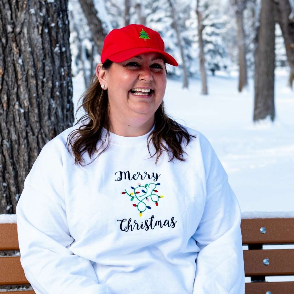 Female wearing a red baseball hat embroidered with a Christmas Tree - DSY Lifestyle