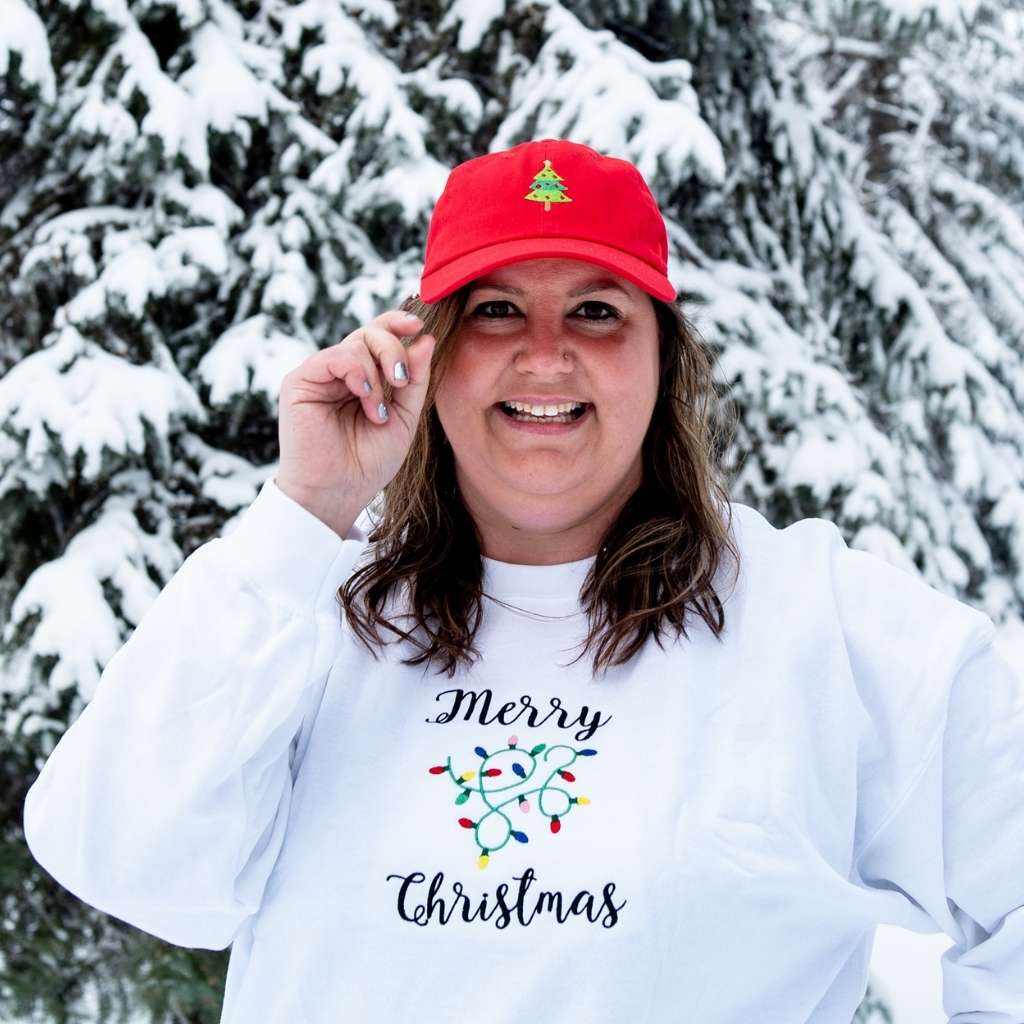 Female wearing a red baseball hat embroidered with a Christmas Tree - DSY Lifestyle