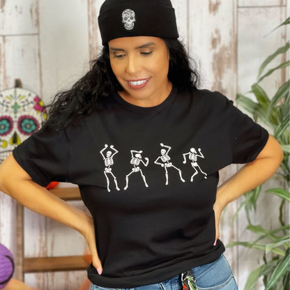 Female wearing a black unisex t-shirt with printed white dancing skeletons in the front - DSY Lifestyle