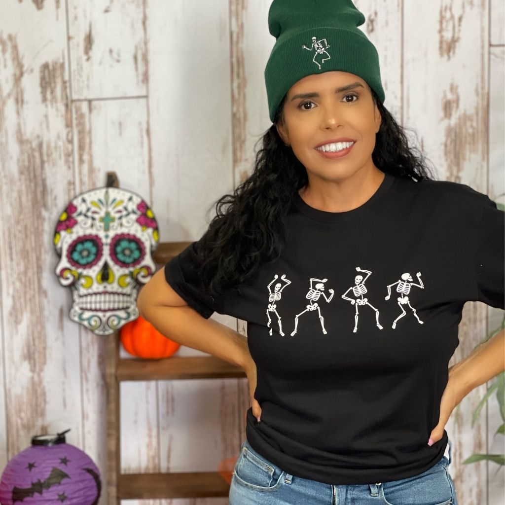 Female wearing a black unisex t-shirt with printed white dancing skeletons in the front - DSY Lifestyle