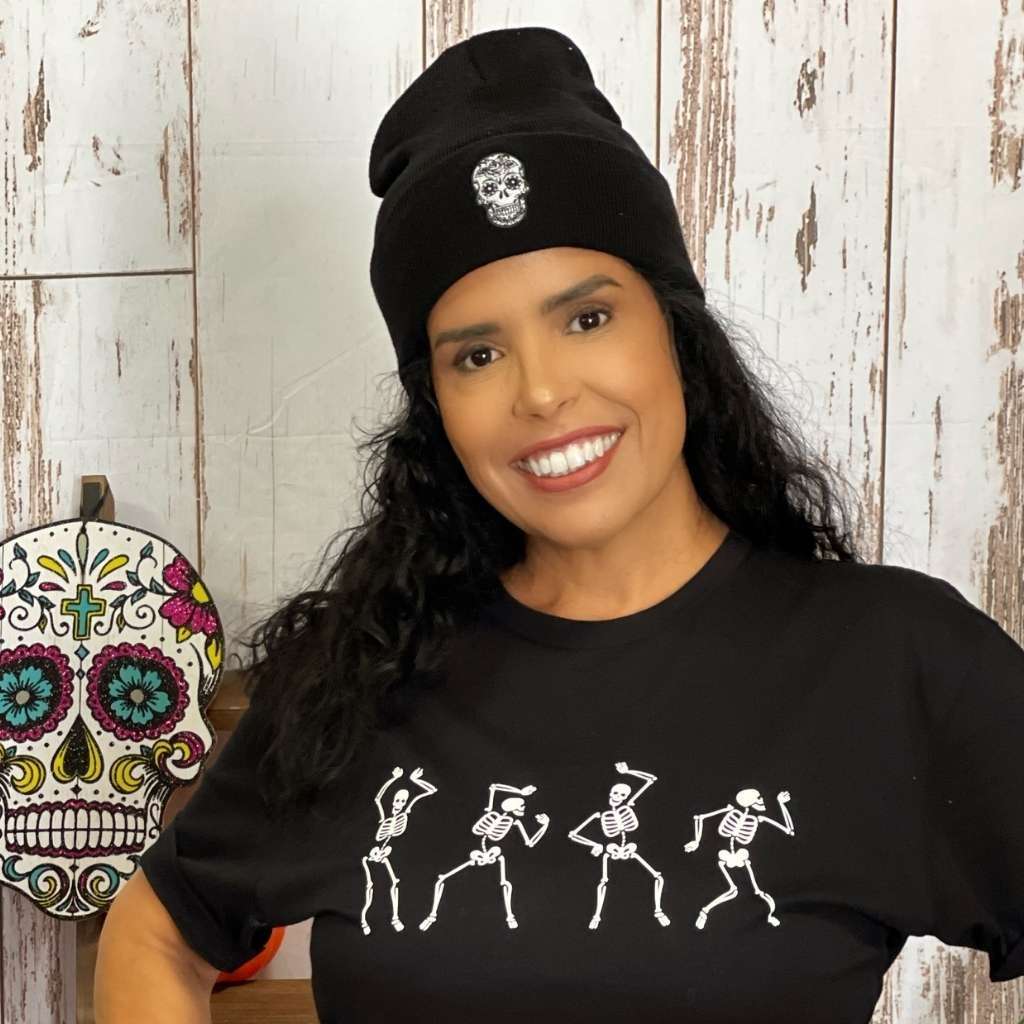 Model wearing black cuffed beanie with sugar skull embroidered on the front - DSY Lifestyle