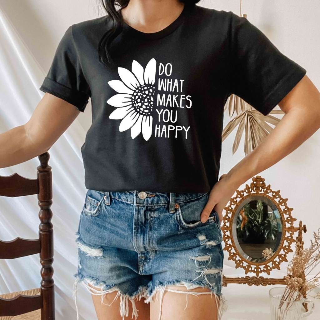 Female wearing a black tshirt printed with Do what makes you happy - DSY Lifestyle