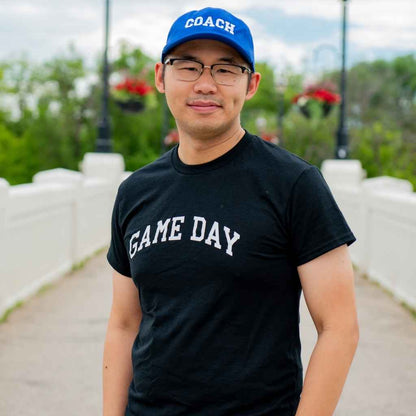 Male wearing a black t-shirt printed with Game Day in white - DSY Lifestyle