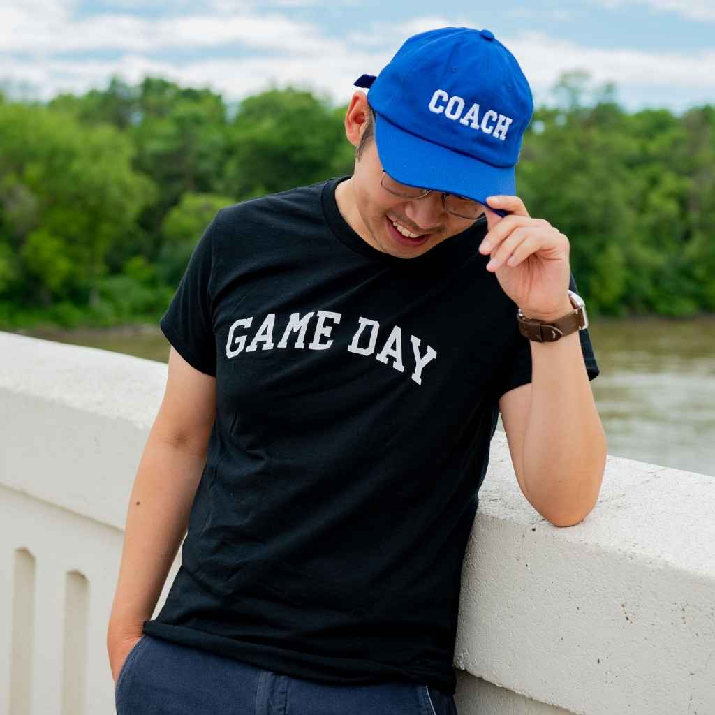 Male wearing a black t-shirt printed with Game Day in white - DSY Lifestyle
