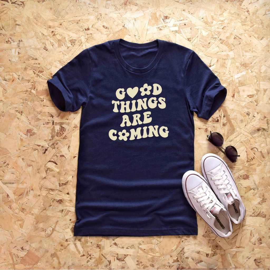 Male wearing a navy tshirt printed with Good Things are coming - DSY Lifestyle