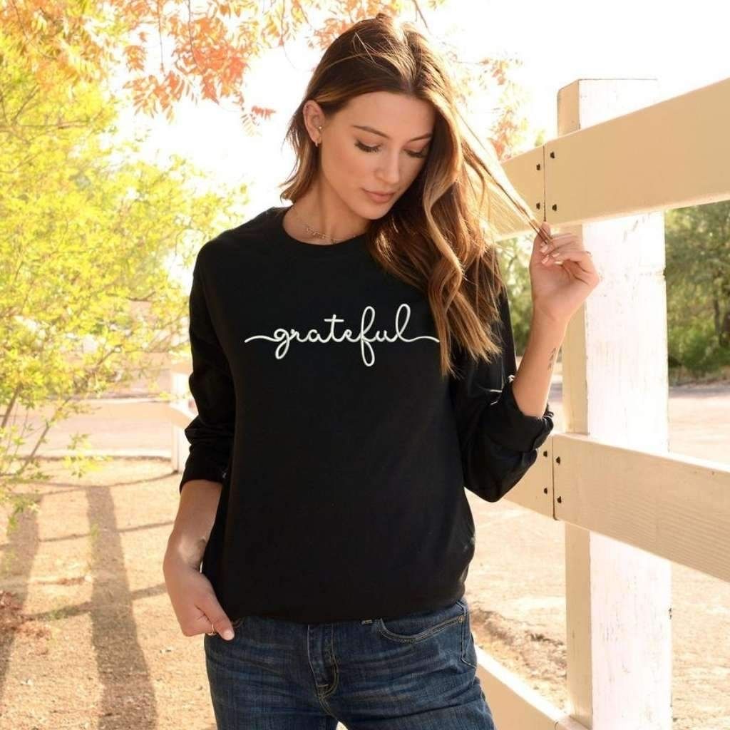 Female wearing a black sweatshirt embroidered with grateful - DSY Lifestyle