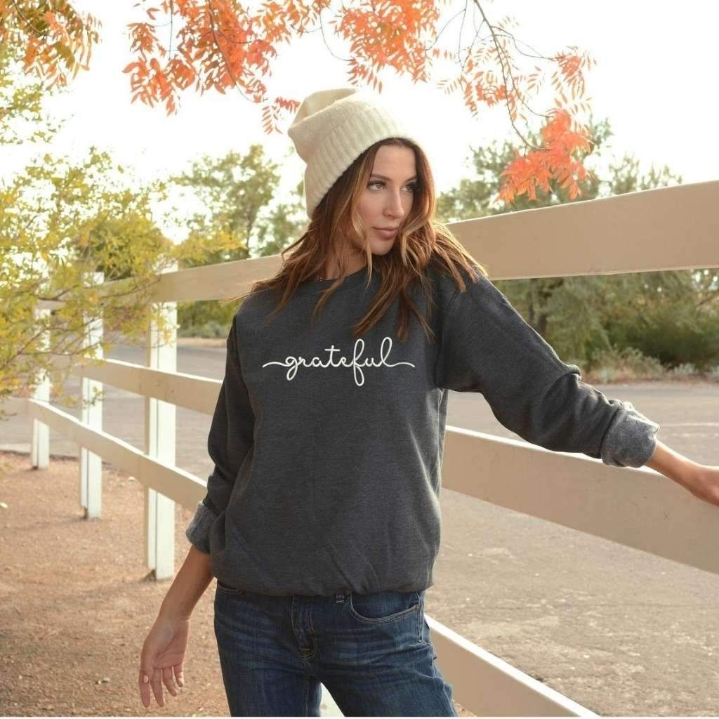Female wearing a dark heather gray sweatshirt embroidered with grateful - DSY Lifestyle