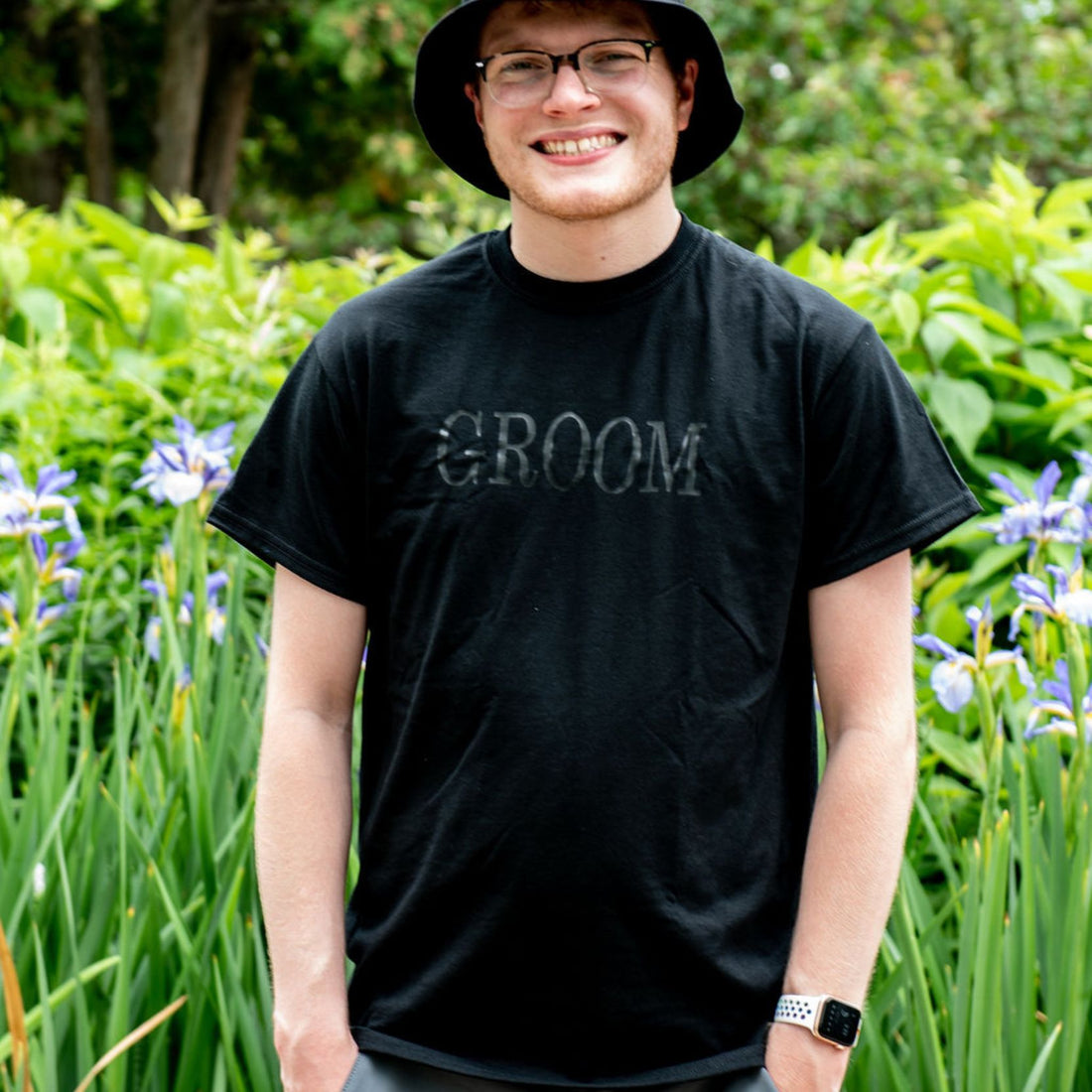 Male wearing a black shirt with Groom printed in black - DSY Lifestyle
