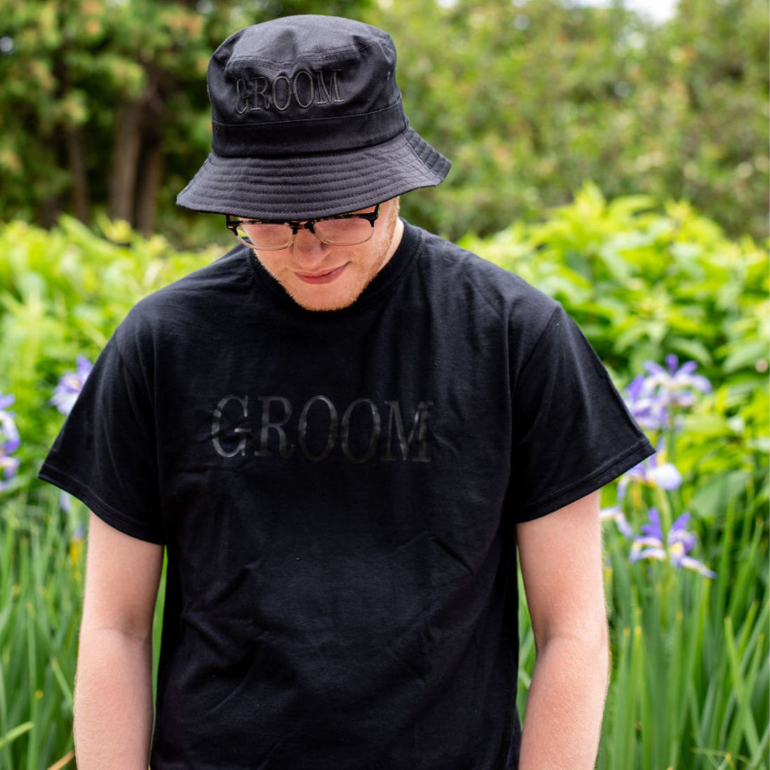 Male wearing a black shirt with Groom printed in black - DSY Lifestyle
